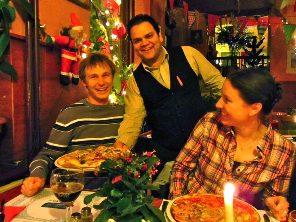 Enthusiastic waiters at pizza restaurant